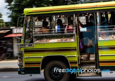 Fast Moving Bus Loaded Full With People Stock Photo