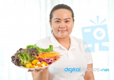 Fat Woman Eating Salad Stock Photo