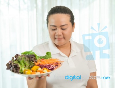 Fat Woman Eating Salad Stock Photo