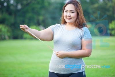 Fat Woman Measuring Her Stomach Stock Photo