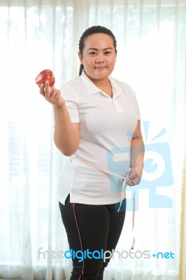 Fat Woman With Apple Stock Photo