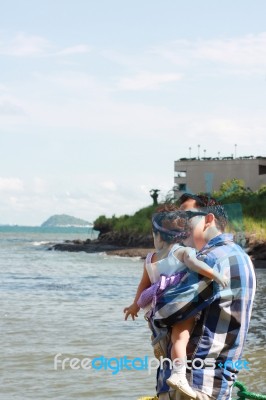 Father And Daughter At The Ocean Stock Photo