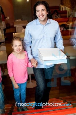 Father And Daughter Posing On Stairs Stock Photo