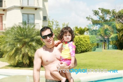 Father And Daughter Swimming Pool Stock Photo