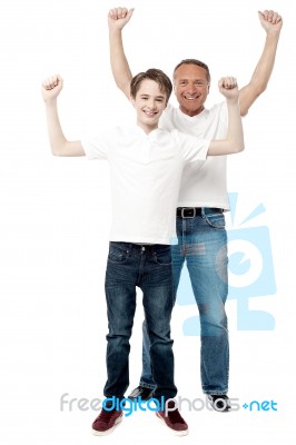 Father And Son Enjoying Their Victory Stock Photo