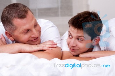 Father And Son Looking Into Each Others Eyes Stock Photo