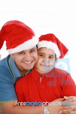 Father And Son With Christmas Hat Stock Photo