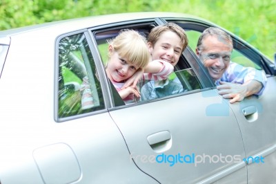 Father Out On A Long Drive With Kids Stock Photo