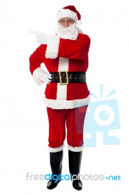 Father Santa Pointing Towards The Copy Space Area Stock Photo