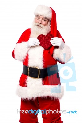 Father Santa Showing A Heart Stock Photo