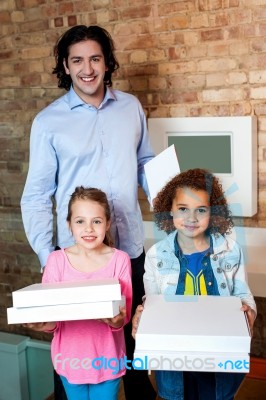 Father With His Daughters At Pizza Outlet Stock Photo