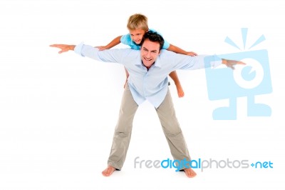 Father With Son On Back Stock Photo