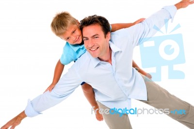 Father With Son On Back Stock Photo