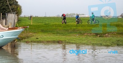 Faversham, Kent/uk - March 29 : Cyclists Pause To Look At The Ri… Stock Photo