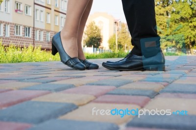 Feet Of Man And Woman While Kissing On A Romantic Meeting Stock Photo