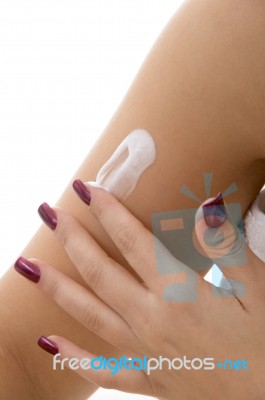 Female Applying Lotion On Hand Stock Photo