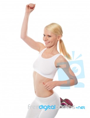 female Athlete Jumping Stock Photo