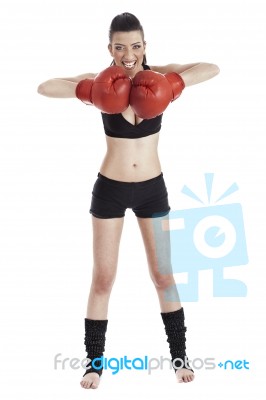 Female Boxer Looking Very Focused With Red Gloves Stock Photo