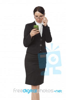 Female Business Professional Using Smart Phone Stock Photo