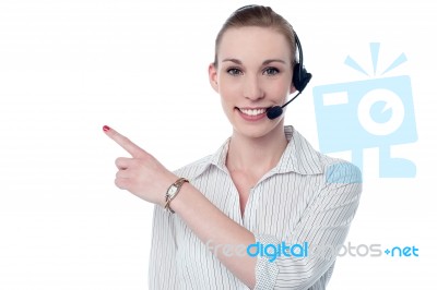 Female Call Center Executive Wearing Headset Stock Photo