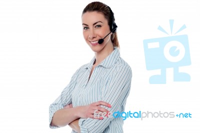 Female Call Centre Agent With Arms Crossed Stock Photo