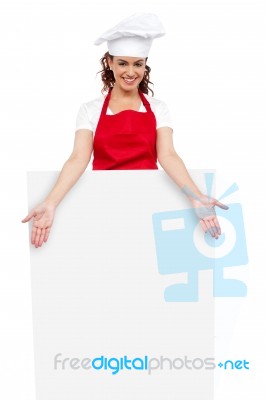 Female Chef Behind Blank Board Stock Photo