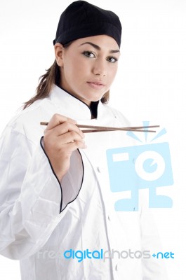 Female Chef Holding Chopstick Stock Photo