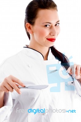 Female Chef Holding Fork And Knife Stock Photo