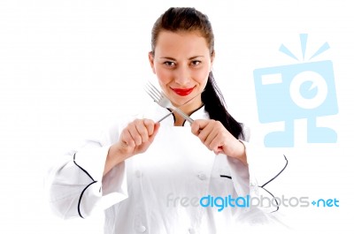 Female Chef Holding Fork and knife Stock Photo