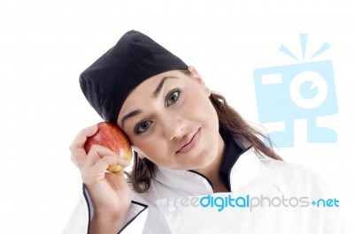 Female Chef Holding Red Apple Stock Photo