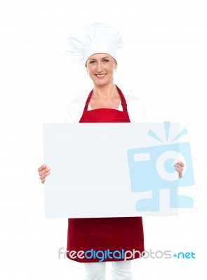 Female Chef Holding White Board Stock Photo