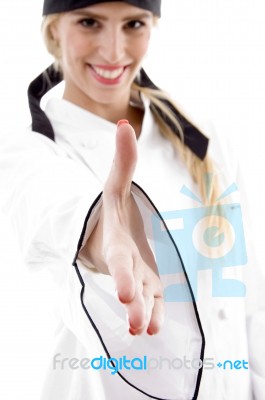 Female Chef Offering Handshake Stock Photo