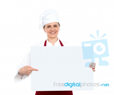 Female Chef Pointing Blank Board Stock Photo