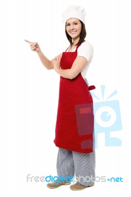 Female Chef Pointing Towards Copy Space Area Stock Photo