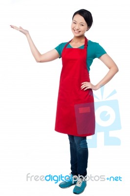 Female Chef Promoting Bakery Product Stock Photo