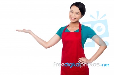 Female Chef Promoting Bakery Product Stock Photo