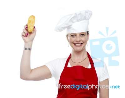 Female Chef Showing Bread Stock Photo