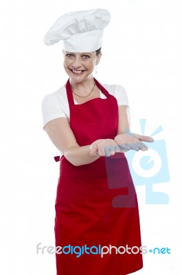 Female Chef Showing Open Palms Stock Photo