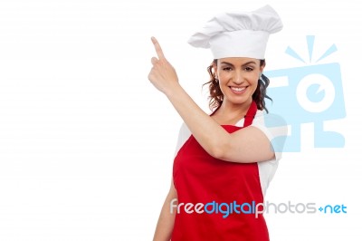 Female Chef showing Pointing Up Stock Photo