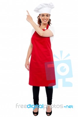 Female Chef showing Pointing Up Stock Photo