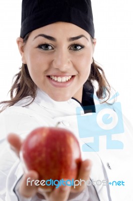 Female Chef Showing Red Apple Stock Photo