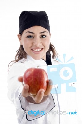 Female Chef Showing Red Apple Stock Photo