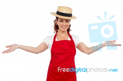 Female Chef Showing Welcome Gesture Stock Photo