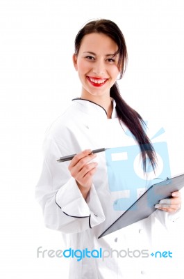 Female Chef Writing Down The Menu Stock Photo