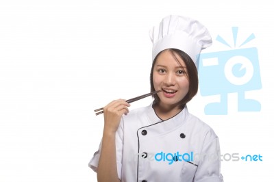 Female Cook With Chopstick Stock Photo