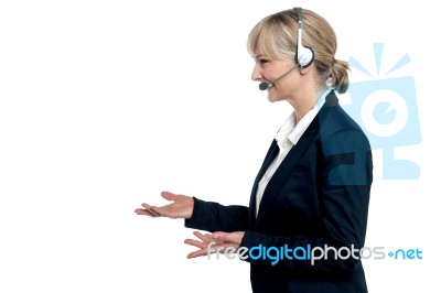 Female Customer Care Agent In A Conversation Stock Photo