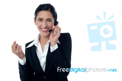 Female Customer Support Executive On Call Stock Photo