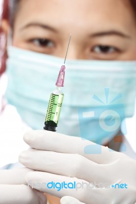 Female Doctor And Syringe Stock Photo