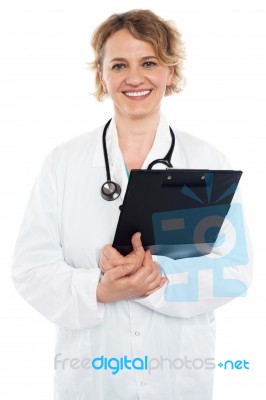 Female Doctor Holding Clipboard Stock Photo