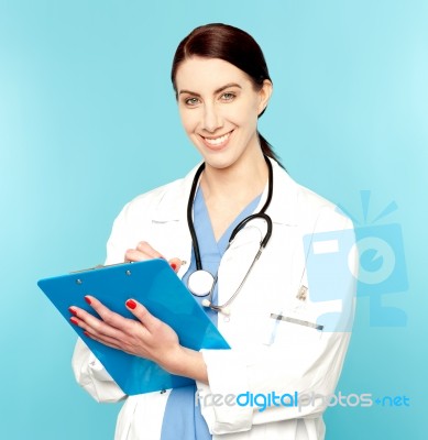 Female Doctor Holding Clipboard Stock Photo